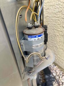 Close-up of an AC unit's capacitor and wiring during an inspection by Usa Air Conditioning & Heating in Las Vegas, NV