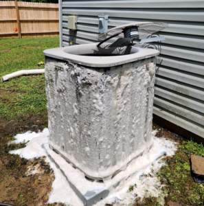 An outdoor AC unit undergoing a professional coil cleaning service by Air Mechanics, LLC in Greensboro, NC.
