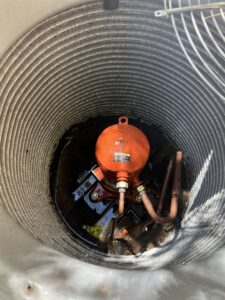 Close-up view of an AC unit's compressor and coils during an inspection by Usa Air Conditioning & Heating in Las Vegas, NV