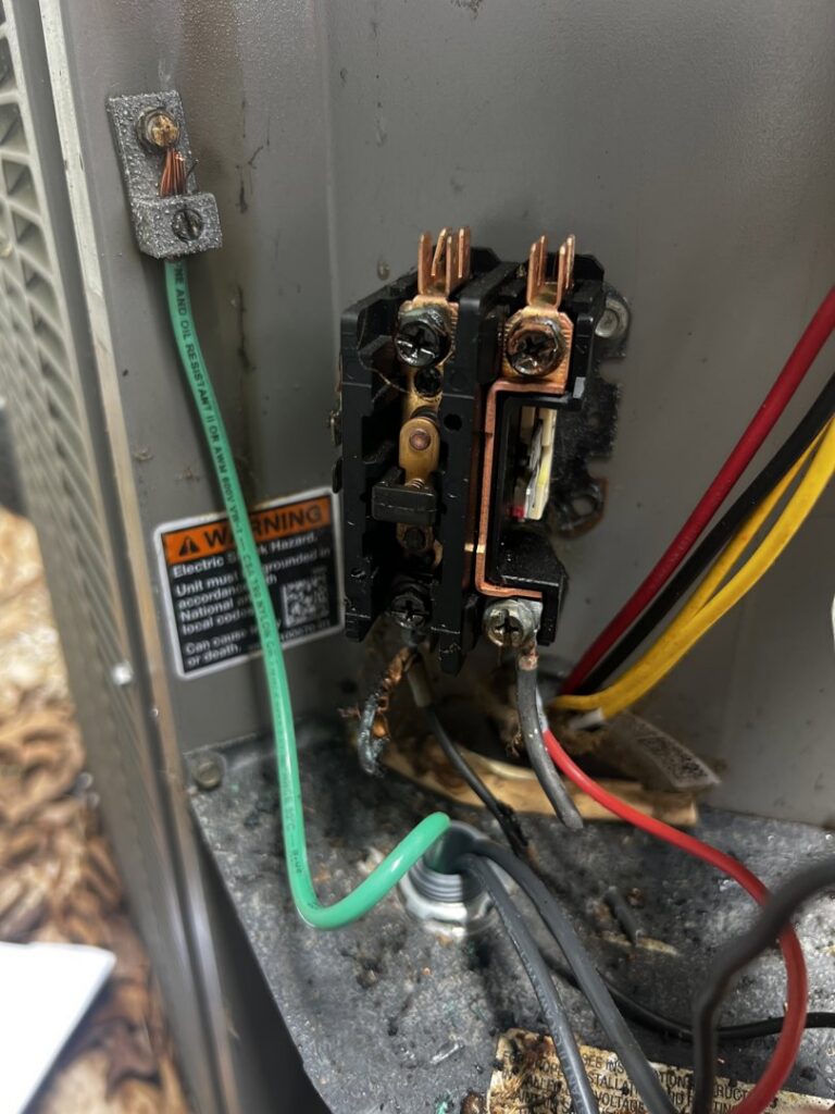 A close-up of electrical components and wiring inside an outdoor AC unit, showing repair work by Simply Home Service in Gaithersburg, MD.