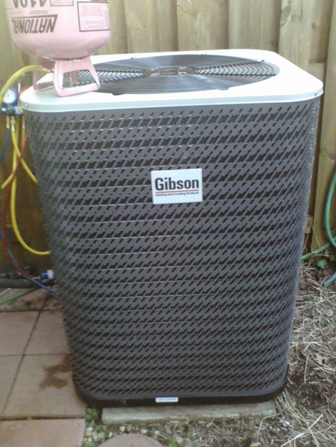 An outdoor AC unit undergoing maintenance with refrigerant gauges connected by Allwaysthere Heating and Cooling in Frederick, MD