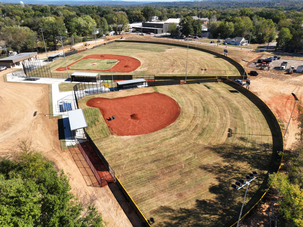 An aerial view of two baseball fields featuring extensive chain-link fencing by The Fence Man in Fort Smith, AR