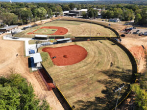 An aerial view of two baseball fields featuring extensive chain-link fencing by The Fence Man in Fort Smith, AR