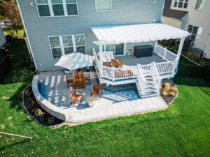 An aerial view of a backyard deck and patio enclosed by a black metal fence installed by Integrous in Gap, PA