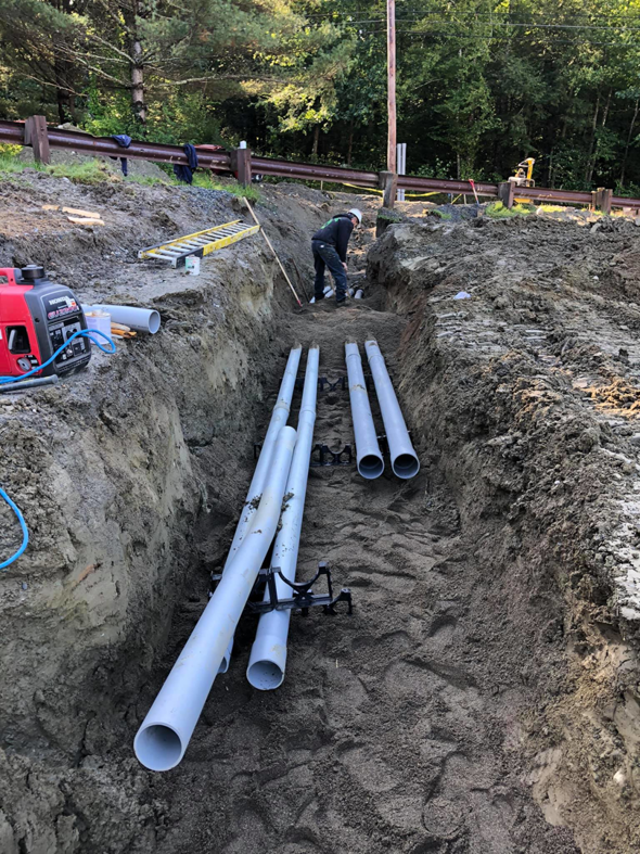 An aerial view of electrical conduit installation at a construction site by Electrical Installations, LLC in Moultonborough, NH.
