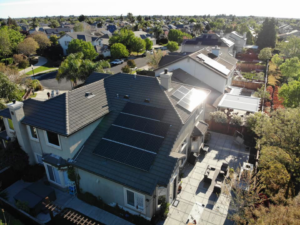An aerial view of a residential home featuring solar panels installed by Element Power Systems, Inc. in Brentwood, CA