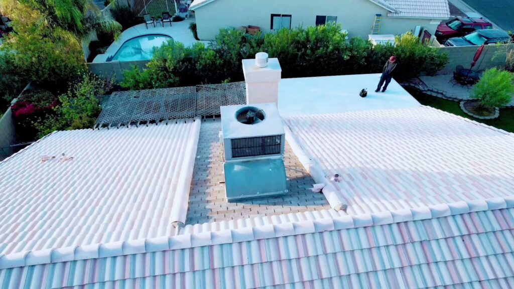 An aerial view of a rooftop HVAC unit on a house, showcasing installation or maintenance by Rusty's Air Conditioning And Heating in Mesa, AZ.