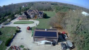 An aerial view of a detached garage with solar panels installed by Three Rivers Electric in Fort Wayne, IN.