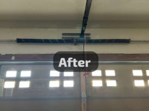An 'After' shot of a garage door torsion spring system, showing successful repair by SS Garage Door Repair in Denver, CO.
