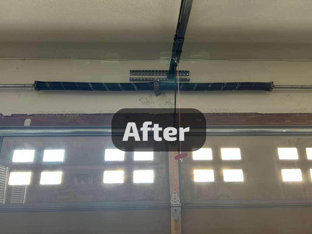 An 'After' shot of a garage door torsion spring system, showing successful repair by SS Garage Door Repair in Denver, CO.