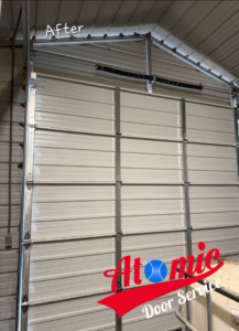 An 'After' photo showing a newly installed or repaired sectional garage door from the interior, completed by Atomic Door Service in Tulsa, OK.