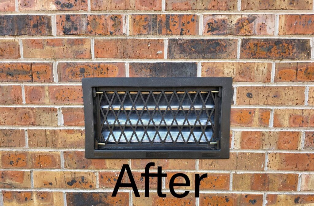 After photo of a newly installed wildlife exclusion vent on a brick wall by Hub City Pest Control in Jackson, TN