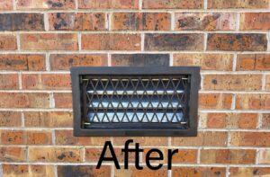 After photo of a newly installed wildlife exclusion vent on a brick wall by Hub City Pest Control in Jackson, TN