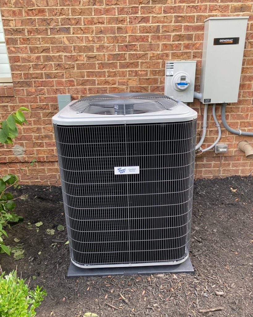 A new outdoor air conditioning unit installed next to a brick home by My HVAC Guy in North Canton, OH.
