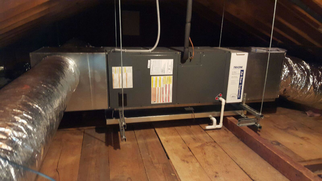 An air handler unit and insulated ductwork installed in an attic by R&M Mechanical Services LLC in Milford, CT.