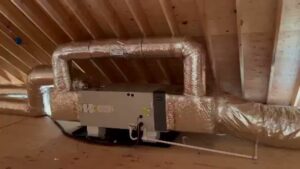 An air handler unit with insulated ductwork installed in an attic by Enviromax Heating & Cooling in Peekskill, NY.