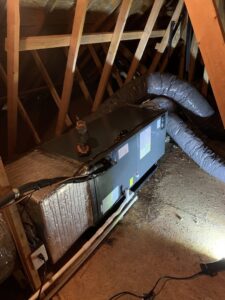 An air handler unit with ductwork installed in an attic space by JDL HVAC Services, LLC in Laurel, MD.