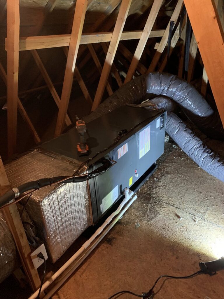 An air handler unit with ductwork installed in an attic space by JDL HVAC Services, LLC in Laurel, MD.
