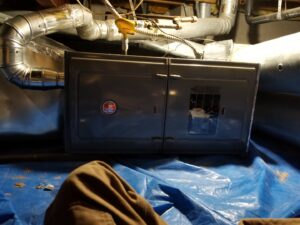 An air handler unit with ductwork installed in a residential space by Thin Air Heating & Cooling Repair in Arvada, CO.