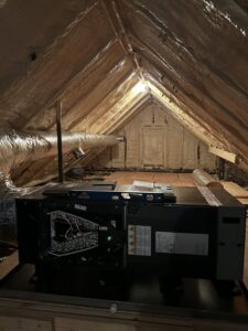 An air handler unit being installed in an attic space by AC Heating and Air Conditioning Services in Charleston, SC.