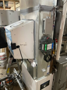 An air purifier installed as part of an HVAC system by Aire Serv of Fargo, ND.
