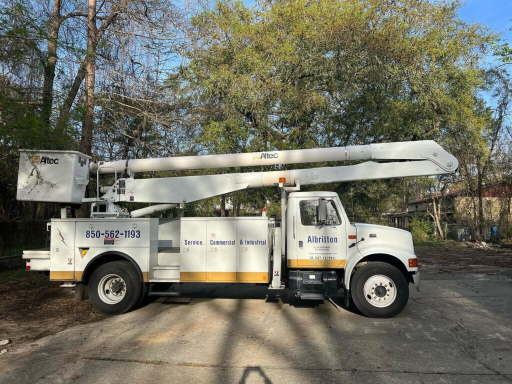 A large Albritton Electrical Service, Inc. bucket truck ready for overhead electrical work in Tallahassee, FL.