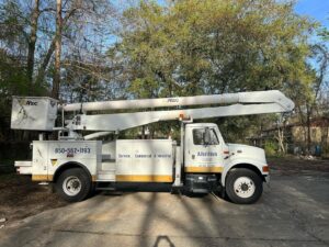A large Albritton Electrical Service, Inc. bucket truck ready for overhead electrical work in Tallahassee, FL.