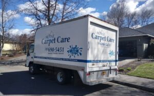 The Alpine Carpet Care service truck parked on a residential street, ready for a job in Medford, OR.