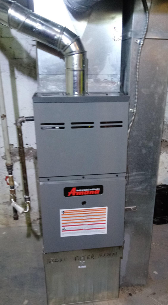 An Amana furnace and ductwork installed in a residential basement by Atmosphere Mechanical Heating And Air / Ventilation in Aurora, CO.