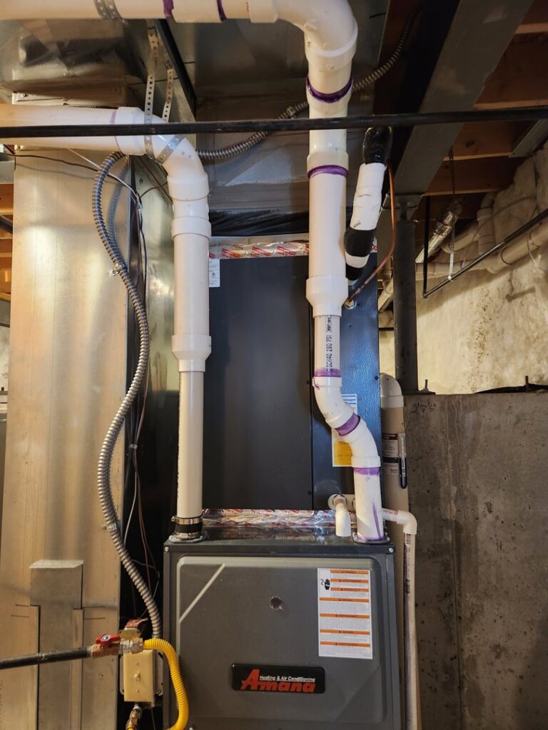 An Amana furnace and ductwork installed in a basement by EPCTL Heating and Cooling in Byers, CO.