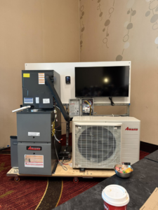 A display of Amana HVAC system components, including indoor and outdoor units, at Mike's Mechanical Services in Sheridan, CO.