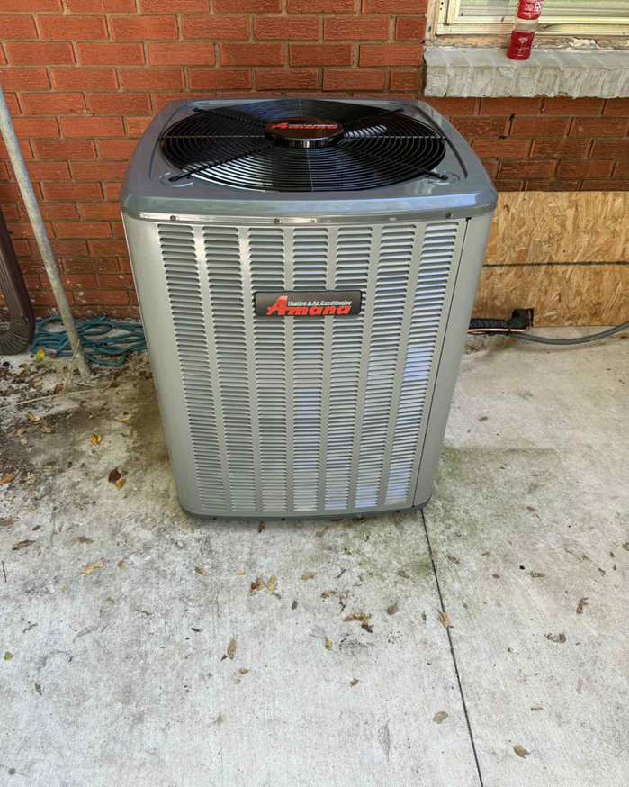 A newly installed Amana outdoor air conditioning unit by AirTech Solutions LLC in Broken Arrow, OK.