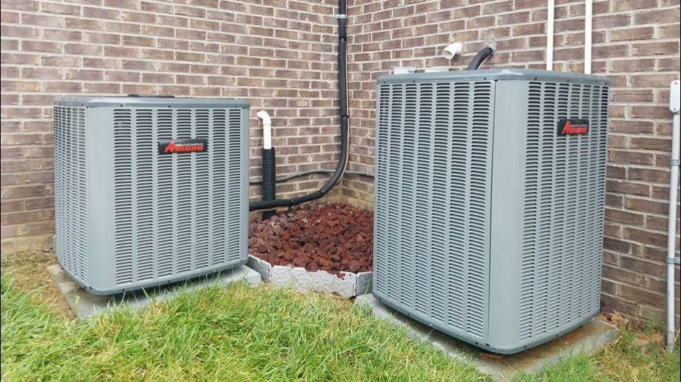 Two Amana outdoor air conditioning units installed side-by-side by C&L Heating and Air in Louisville, KY.