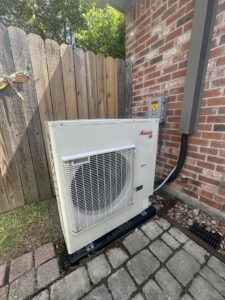 An Amana outdoor mini-split condenser unit installed at a residence by Grand Slam Heating & Air in Baton Rouge, LA.