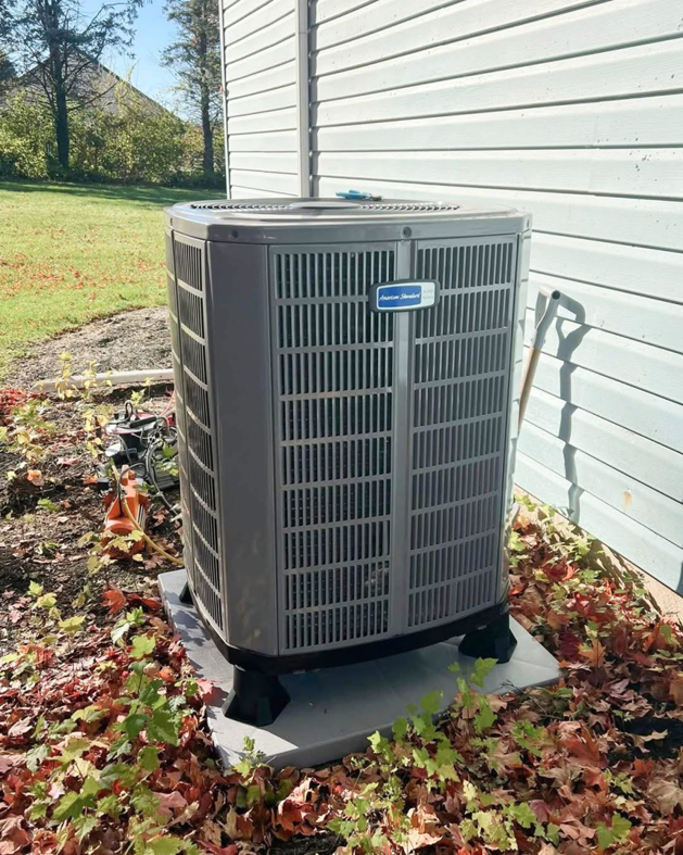 An American Standard outdoor AC unit installed next to a home by Allen Brown Heating & Cooling LLC in Athens, AL.