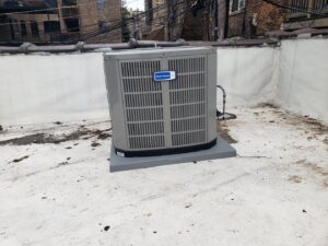 An American Standard outdoor air conditioning unit installed on a rooftop by Service Pro Titans in Chicago, IL.