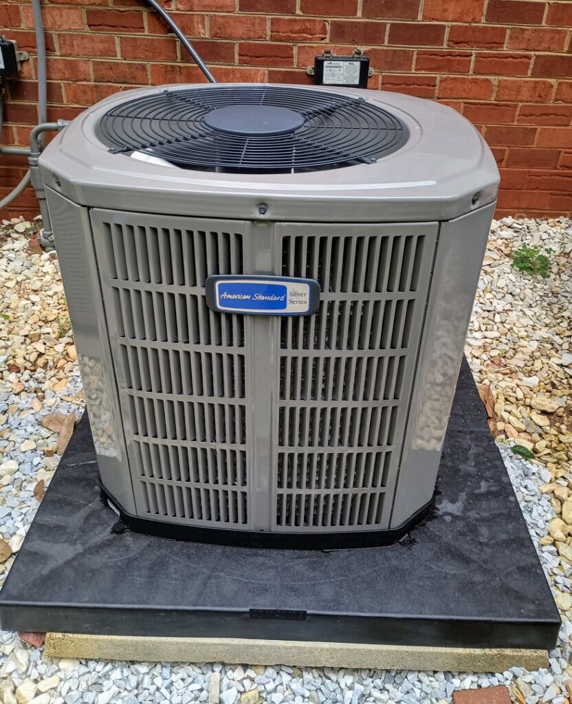 An American Standard HVAC condenser unit installed by Barnette Heating and A/C in Mocksville, NC.
