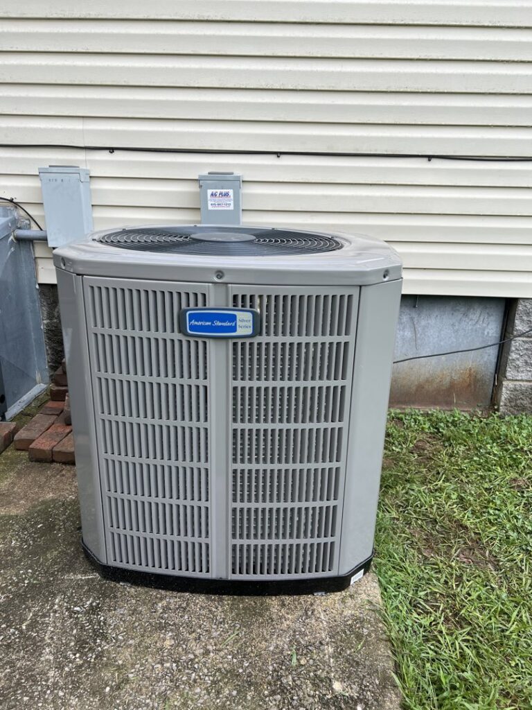 An American Standard outdoor AC unit installed next to a house by A/C Company Since 1988 in Murfreesboro, TN.