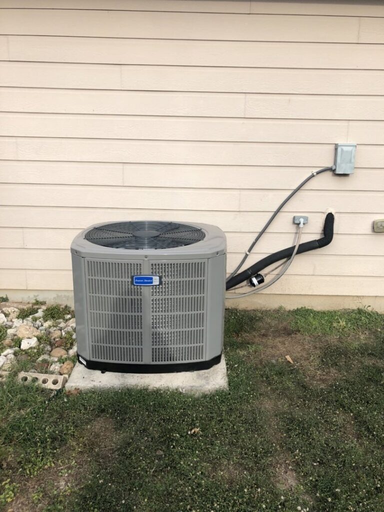 An American Standard outdoor AC unit installed at a residential property by Eagle Heating & A/C in San Antonio, TX.