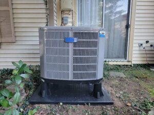 An American Standard outdoor HVAC condenser unit installed next to a home by Tack Mechanical LLC in Baltimore, MD.
