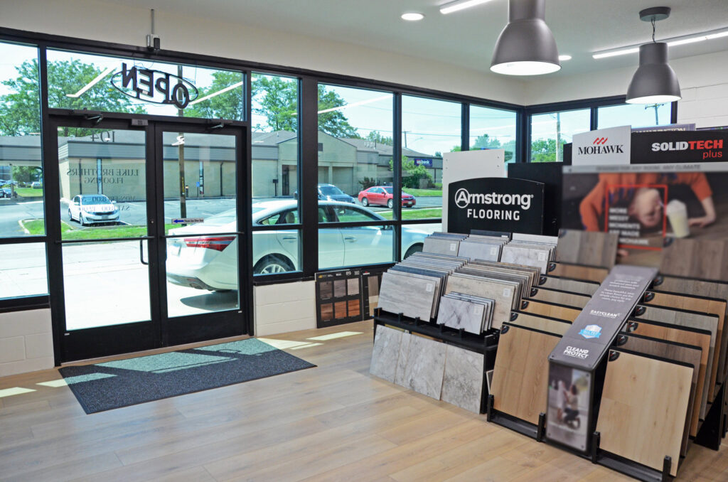 Anderson Tuftex carpet display showcasing various styles and textures at Luke Brothers Flooring in Ankeny, IA.