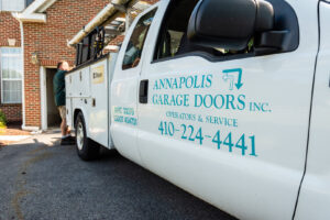 Annapolis Garage Doors Inc. service truck parked at a client's home in Annapolis, MD, ready for a garage door job.