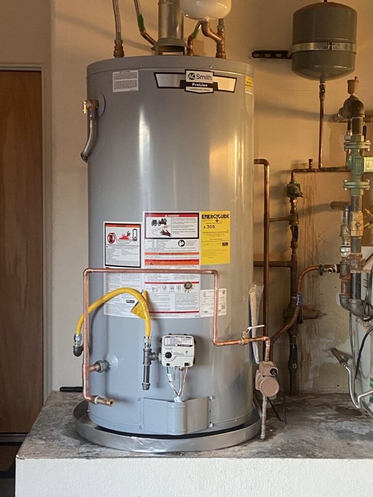 A new A.O. Smith water heater professionally installed with gas and water lines by Santa Fe Heating & Cooling LLC in Santa Fe, NM.