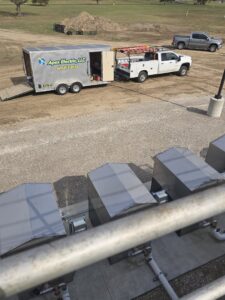 An Apex Electric LLC utility truck and trailer parked at a job site, ready for electrical services in Brea, CA.