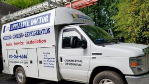 A branded service van for Appliance Doctor, Inc. showcasing heating, cooling, and refrigeration services in Annapolis, MD.