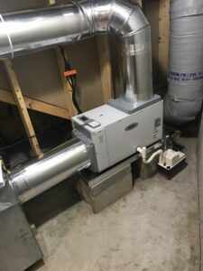 An AprilAire whole-house humidifier installation by Quality Comfort Inc. in Aston, PA