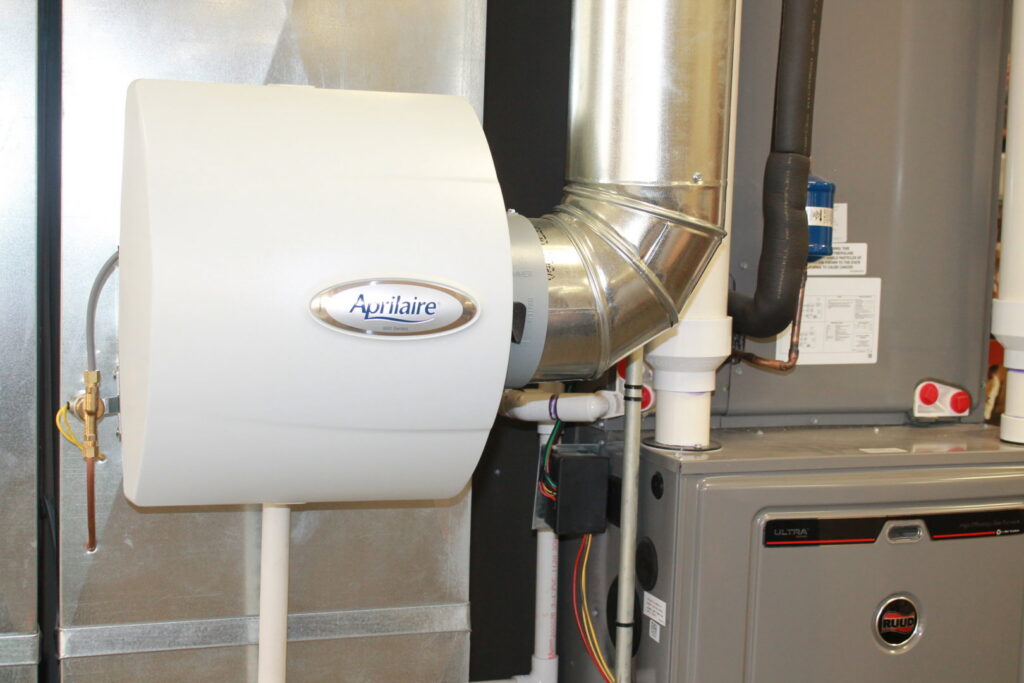 An Aprilaire whole-home humidifier installed with a furnace and ductwork by West Wichita Heating & Air Conditioning in Wichita, KS.