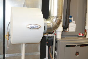 An Aprilaire whole-home humidifier installed with a furnace and ductwork by West Wichita Heating & Air Conditioning in Wichita, KS.