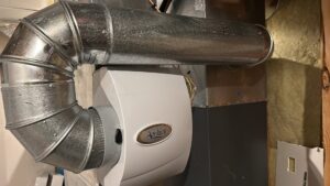 An Aprilaire whole-house humidifier installed with ductwork by Trade Allies Heating and Cooling in Ankeny, IA.