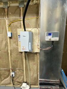 An Aprilaire whole-house humidifier unit installed with ductwork by Infinite Heating & Air in Newnan, GA.